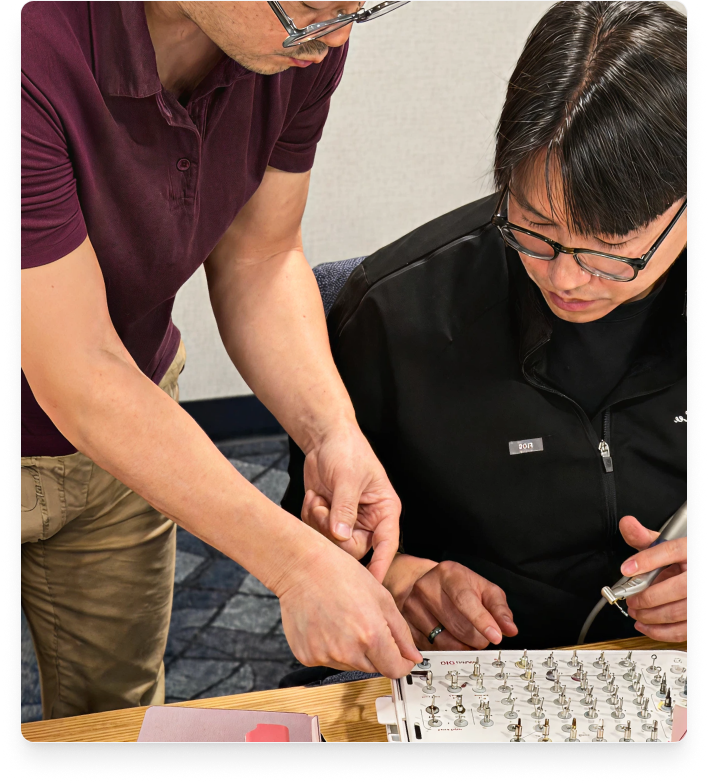 DIO Navi instructor showing student how to place implants.